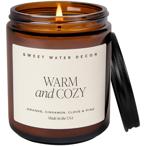 Sweet Water Decor Warm & Cozy Candle, 9oz Amber Glass Jar, Winter Scents | Cozy Scented Candle with Orange Peel, Cinnamon, Ginger & Clove Notes, Black Lid, 40+ Hour Burn Time, Poured in the USA