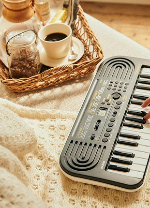 Casio Casiotone SA-51 – 32-Key Compact Digital Keyboard | Portable Electronic Piano with 100 Tones, 50 Rhythms & Built-In Songs | Battery Powered