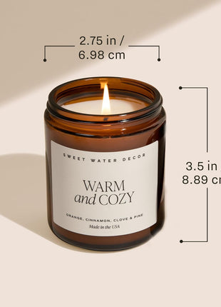 Sweet Water Decor Warm & Cozy Candle, 9oz Amber Glass Jar, Winter Scents | Cozy Scented Candle with Orange Peel, Cinnamon, Ginger & Clove Notes, Black Lid, 40+ Hour Burn Time, Poured in the USA