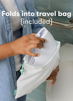 Frida Baby Fold-and-Go Portable Potty Seat for Toilet, Foldable Travel Potty Seat for Toddler, Fits Round & Oval Toilets, Non-Slip Base, Handles, Includes Free Travel Bag
