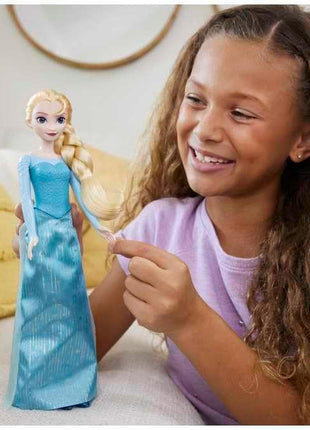 Mattel Disney Frozen Elsa Fashion Doll in Frozen 1 Look | Posable Doll in Signature Blue Dress with Cape, Skirt & Shoes and Braided Hair, Inspired by Disney Frozen