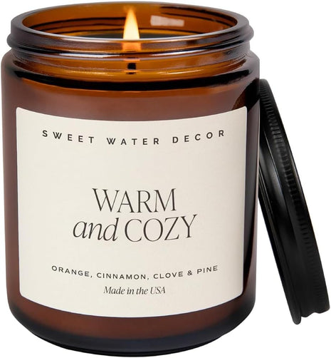 Sweet Water Decor Warm & Cozy Candle, 9oz Amber Glass Jar, Winter Scents | Cozy Scented Candle with Orange Peel, Cinnamon, Ginger & Clove Notes, Black Lid, 40+ Hour Burn Time, Poured in the USA