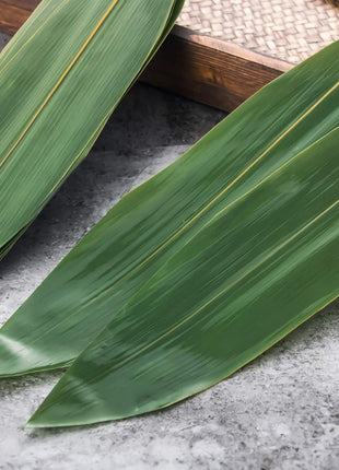 100 pcs Sushi Bamboo Leaf - Banana Leaves Make Zongzi Kit Plate Decorations Holiday Party for cooking (100 pcs, 12 inch L x 3.2 inch W) - Leaves Remains Vaccuum and Fresh
