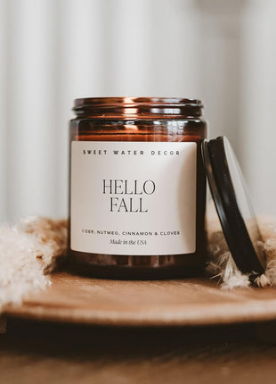 Sweet Water Decor Hello Fall Candle, 9oz Amber Jar, Autumn Scents for Home | Hot Cider, Cinnamon, Cloves, & Nutmeg Soy Wax Scent Notes, 40+ Hour Burn Time, Glass Jar, Black Lid, Thanksgiving & Halloween