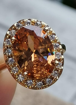 GUIDECUN Golden Tone Oval Shaped Champagne CZ & Round Clear Cubic Zirconia Halo Cocktails Engagement Ring for Woman (US Size 7)